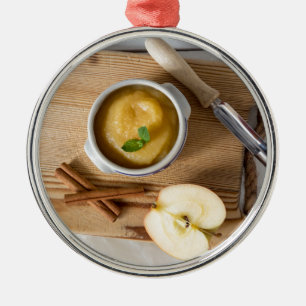Applesauce with cinnamon in stoneware bowl silbernes ornament