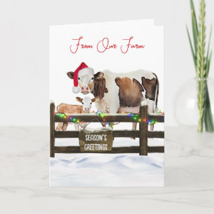 Aquarell-Weihnachtskühe mit Weihnachtsmannmütze Feiertagskarte