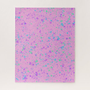 Aquarellfarbener Spritzer auf dem rosa Puzzle