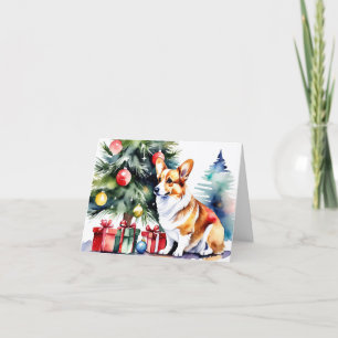 Aquarellkorgi vor dem Weihnachtsbaum Feiertagskarte