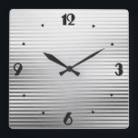 Art Deco Silver Satin Quadratische Wanduhr<br><div class="desc">An elegant Art Deco geometric striped pattern clock in a silver / chrome satin gradient,  with a slight,  raised,  3-d effect and large black numbers in a Deco machen</div>