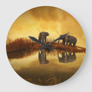 Asian Elephants in Thailand under a glowing sunset Große Wanduhr
