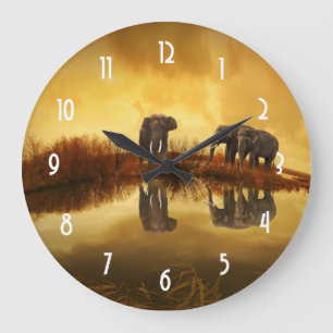 Asian Elephants in Thailand under a glowing sunset Große Wanduhr