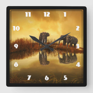 Asian Elephants in Thailand under a glowing sunset Quadratische Wanduhr