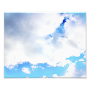Aufgebauschte weiße Wolken und blauer Himmel Fotodruck