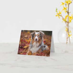Australischer Schäferhund im Herbstlaubfall inspir Karte