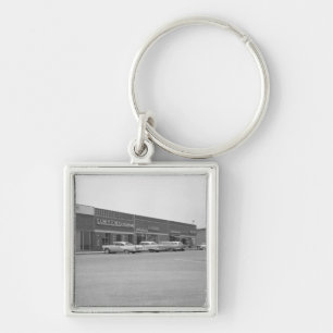 Autos auf dem Einkaufszentrum, das B&W parkt Schlüsselanhänger