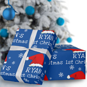 Baby`s erstes Weihnachten blaues Santa-Hütchen Sch Geschenkpapier