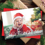 Baby's First Christmas Modern Script Foto Feiertagskarte<br><div class="desc">Diese Weihnachtsfotokarte verfügt über ein horizontales Vollbild (auch "Vollblut" genannt) Foto und eine Kalligraphie,  die in Weiß grüßt. Der Gruß auf der Vorderseite lautet "Baby's First Christmas". Die Rückseite hat ein koordinierendes rot-weißes Punktmuster. Sie können auch ein anderes Foto und/oder einen zusätzlichen Text auf der Rückseite hinzufügen.</div>