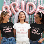 Bachelorette Party Most Likely To Get Married<br><div class="desc">Bring a touch of playful anticipation to the bachelorette festivities with this charming and customizable t-shirt design! Featuring the perfectly fitting phrase "most likely to GET MARRIED" in delicate pink lettering against a crisp white background, this design is both sweet and sassy. It's an ideal choice for the bride-to-be or...</div>