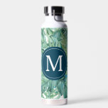 Back To School Custom Tropical Leaves Trinkflasche<br><div class="desc">These insulated water bottles feature tropical leaves in shades of green. Use the template fields to add your custom monogram. A fun choice for back to school. To see the complete line of dorm room essentials visit www.zazzle.com/dotellabelle

Watercolor art and design by Victoria Grigaliunas from Do Tell A Belle</div>