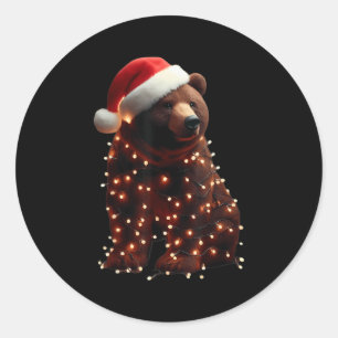 Bär mit Weihnachtsmannmütze und Weihnachtslicht We Runder Aufkleber