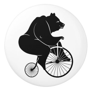 Bärn-schwarze Silhouette, die ein Fahrrad reitet Keramikknauf