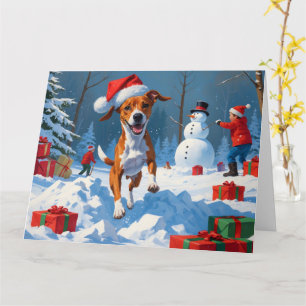 Basenji-Hund spielt im Schnee Winter Szene Karte