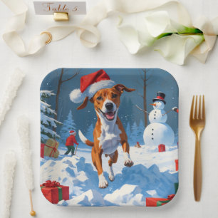 Basenji-Hund spielt im Schnee Winterlandschaft Pappteller