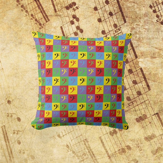 Bass Clef Music Pop Kunst, Dichtung und Musik Kissen (A throw pillow with a pop art pattern of bass clef music symbols.)