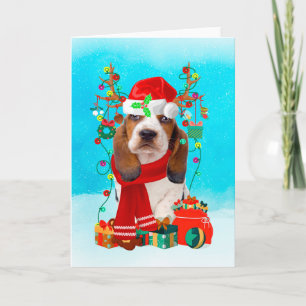 Basset Hound im Schnee mit Weihnachtsgeschenken Karte