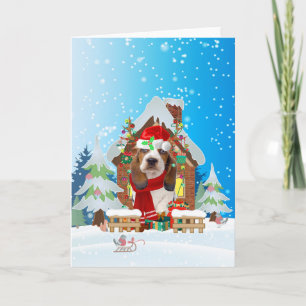 Basset Hound im Schnee mit Weihnachtsgeschenken Karte
