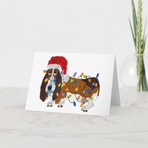 Basset in Weihnachtsbeleuchtung getanzt Feiertagskarte
