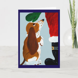 Basset-Welpe bekommt ein Haustier von Santa Karte