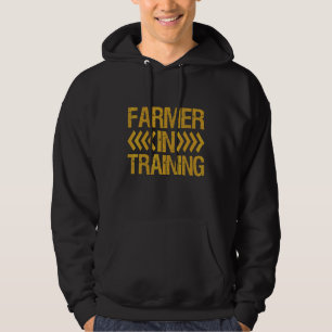 Bauer in der Ausbildung von Sohn von Kindern in de Hoodie