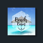 Beach Bum Typografie - Regenschirm am Tropical Bea Leinwanddruck<br><div class="desc">Ein Leinwand mit tropischem Bild eines türkisfarbenen Meeres und ein weißer Sandstrand,  ein Single mit Sonnenschirm aus Strohdach steht alleine da. Typografie sagt Beach Bum.</div>