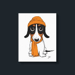 Beanie Dog | Niedliche Dackel Piebald Leinwanddruck<br><div class="desc">Cartoon-Stil gezeichnet von einer schwarz, bräunlich und weiß Piebalds Dackel mit einer orangefarbenen Mütze und Schal. Eine lustige Leinwand für alle, die Dackel Hunde Lieben. Besuchen Sie Jenn's Doodle World für noch mehr Illustrationen von süße Tier- und Hundeliebhaber.</div>