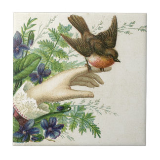 Beautiful hand with a bird and flowers fliese