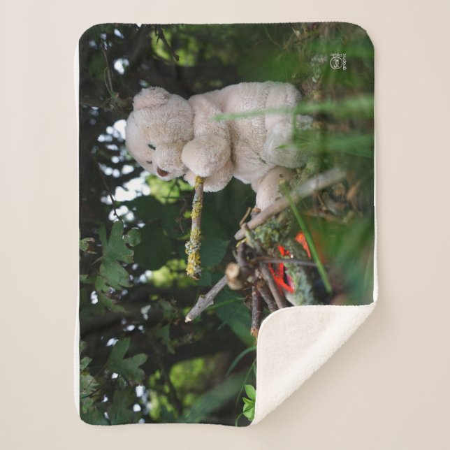 Beertje dat bij kampvuur zit. sherpadecke (Vorderseite)