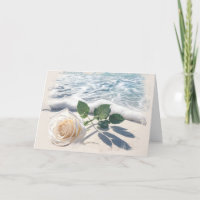 Beileid mit weißer Rose am Strand