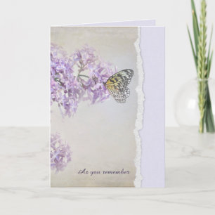 Beileid-Schmetterling auf Lilac mit gerissener Kan Karte