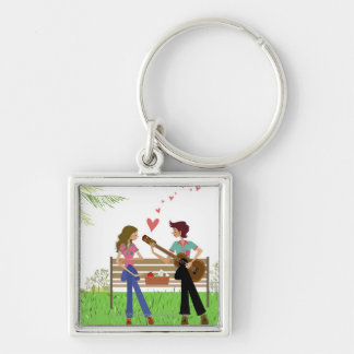 Bemannen Sie das Spielen der Gitarre mit einer Schlüsselanhänger