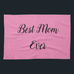 Beste Mutter je Text pink Geschirrtuch<br><div class="desc">"Beste Mama je",  elegant in einem lebendigen Schriftart umrahmt,  hebt sich vor einem weichen rosa Hintergrund ab und verleiht den hochgeehrten Matriarchis ein herzliches Lob in einem kühnen und liebevollen Design.</div>
