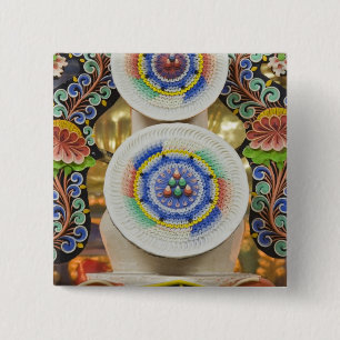 Bhutan. Zwergkuchen von Mönchen schmücken die Button