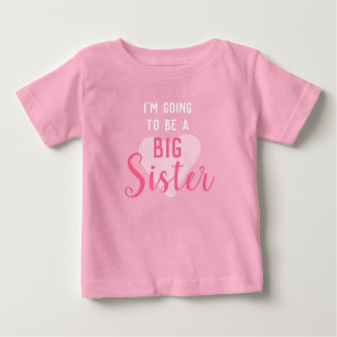 Big Sister enthüllt niedliches Rosa Baby T-shirt