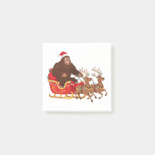 Bigfoot fährt mit einem Weihnachtsschlitten durch Post-it Klebezettel
