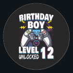 Birthday Boy Level 12 Unlocked Video Game 12th Runder Aufkleber<br><div class="desc">Birthday Boy Level 12 Unlocked Video Game 12th Birthday Game Gift. Perfect gift for your dad,  mom,  papa,  men,  women,  friend and family members on Thanksgiving Day,  Christmas Day,  Mothers Day,  Fathers Day,  4th of July,  1776 Independent day,  Veterans Day,  Halloween Day,  Patrick's Day</div>
