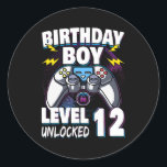 Birthday Boy Level 12 Unlocked Video Game 12th Runder Aufkleber<br><div class="desc">Birthday Boy Level 12 Unlocked Video Game 12th Birthday Game Gift. Perfect gift for your dad,  mom,  papa,  men,  women,  friend and family members on Thanksgiving Day,  Christmas Day,  Mothers Day,  Fathers Day,  4th of July,  1776 Independent day,  Veterans Day,  Halloween Day,  Patrick's Day</div>