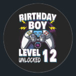 Birthday Boy Level 12 Unlocked Video Game 12th Runder Aufkleber<br><div class="desc">Birthday Boy Level 12 Unlocked Video Game 12th Birthday Game Gift. Perfect gift for your dad,  mom,  papa,  men,  women,  friend and family members on Thanksgiving Day,  Christmas Day,  Mothers Day,  Fathers Day,  4th of July,  1776 Independent day,  Veterans Day,  Halloween Day,  Patrick's Day</div>