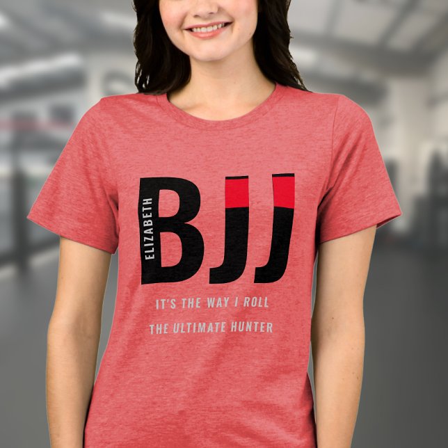 BJJ Brazilian Jiu Jitsu Add Name Woman's Tri-Blend Shirt (Red BJJ woman's Tshirt worn by a female model in a gym.)