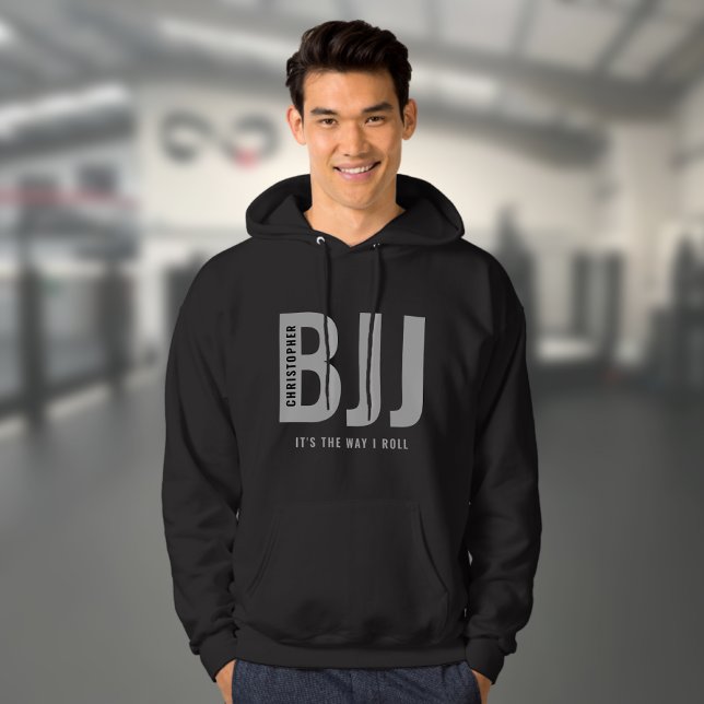 BJJ Brazilian Jiu Jitsu Edit Name & Text Lässig Hoodie (Personalized black BJJ hoodie worn by a male model in a gym)