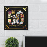 Black and Gold Foto zum 50. Hochzeitstag<br><div class="desc">Erstellen Sie Ihre eigene 50. Hochzeit-Jubiläumswand mit einigen Ihrer Lieblingssendungen aus den letzten 50 Jahren. Dieses elegante Schwarz-Gold-Design verfügt über eine 50-förmige Foto-Collage mit einem Kunstrahmen im Deko-Stil und verzierter Schriftzeichen-Typografie. Die Foto-Collage enthält Platz-, Landschafts- und Portraitbilder, um Ihnen viele Möglichkeiten für die Platzierung zu bieten. Die Vorlage ist Set...</div>
