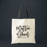 Black Hand Letter Matron of Honour Tote Bag Tragetasche<br><div class="desc">Moderne und klassische Tasche mit schwarzer Schrift MATRON OF HONOR. Personalisieren Sie das,  indem Sie den Namen des Empfängers oder den Hashtag der Hochzeit hinzufügen. Ideal als Geschenk für Ihre Hochzeitsfeier oder Ihr Brautparty.</div>