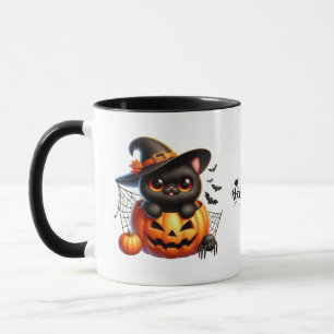 Black Kitten in einem Halloween-Kürbis Tasse