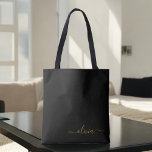 Black Name Gold Girly Script Monogram Modern<br><div class="desc">Schwarz und Gold Elegant Fügen Sie Ihren eigenen Namen Monogram Book Bag. Diese Büchertasche kann auf Ihren Vor- und Vornamen angepasst werden und als Geschenk für Weihnachten,  Geburtstag,  Brautparty oder Hochzeit.</div>