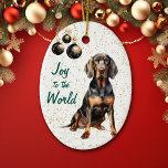 Black Tan Coonhound Dog Joy to the World Christmas Keramik Ornament<br><div class="desc">Auf der Vorderseite dieses Holiday-Ornament ist ein Bild eines schönen schwarzen und bräunlichen Coonhound Hund sitzend vor einem goldenen Konfetti Hintergrund. An der links Seite hängen Zierelemente aus schwarzem und goldenem Baum. Im grünen Text steht "Joy to the World". Die Rückseite des Ornaments hat den gleichen Konfetti-Hintergrund und Textfelder, damit...</div>