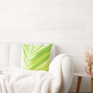 Blätter von hellen Pastellfarben, grüne Palmen Kissen