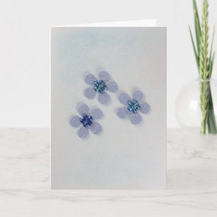 Blau blühende Blumen mit glänzender Dekoration Karte