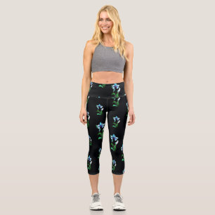 Blau-grüne Neonfarben-Blume auf schwarz Capri Leggings