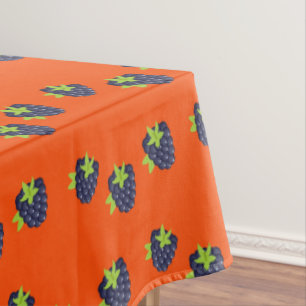 Blaubeerenfruchtmuster auf Orange Tischdecke